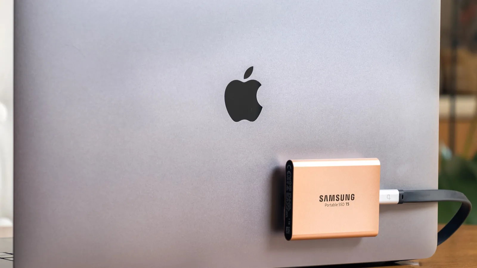 Samsung T5 portable SSD hard drive connected to a Macbook