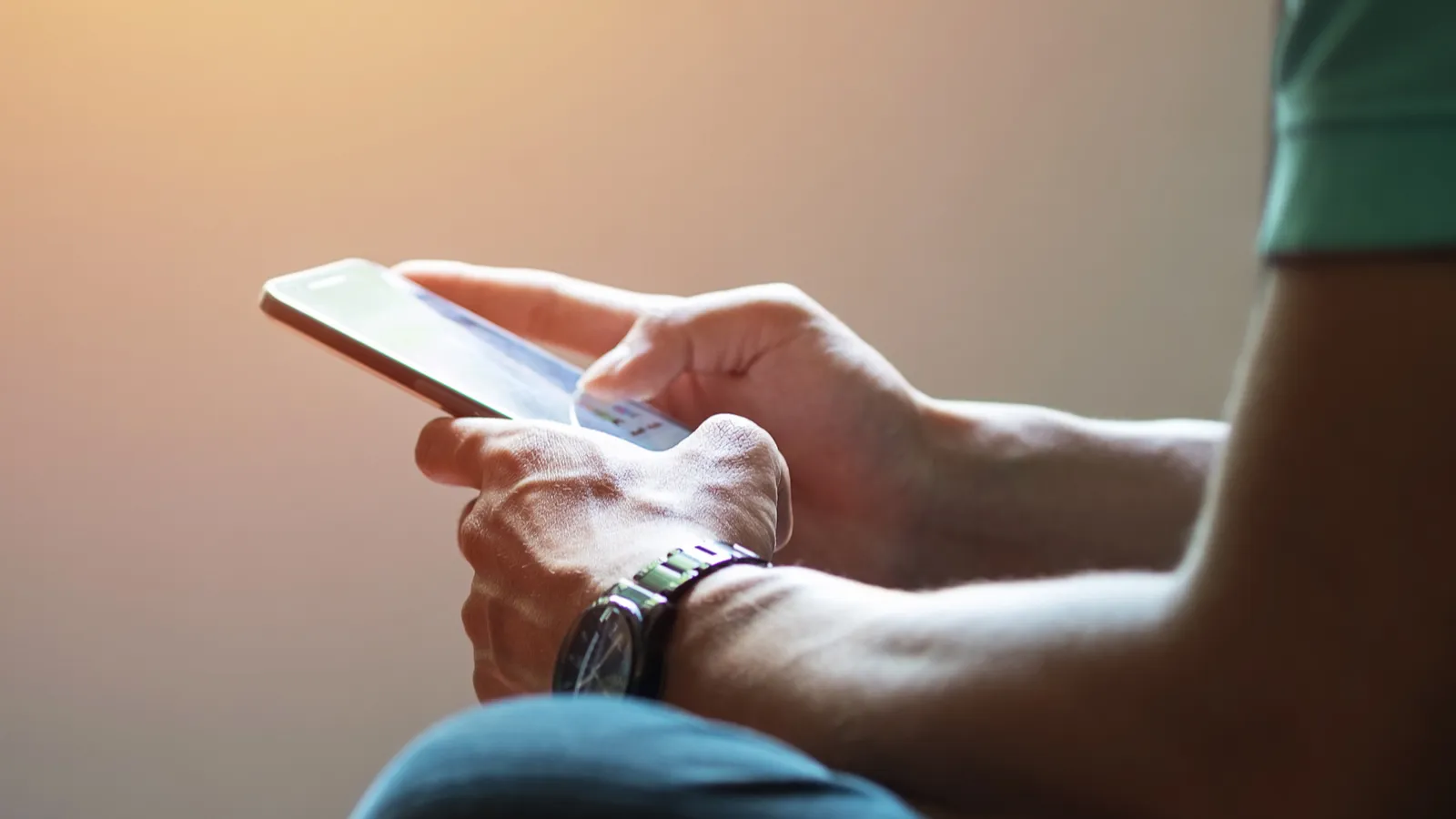 Person using a touch screen smart phone.